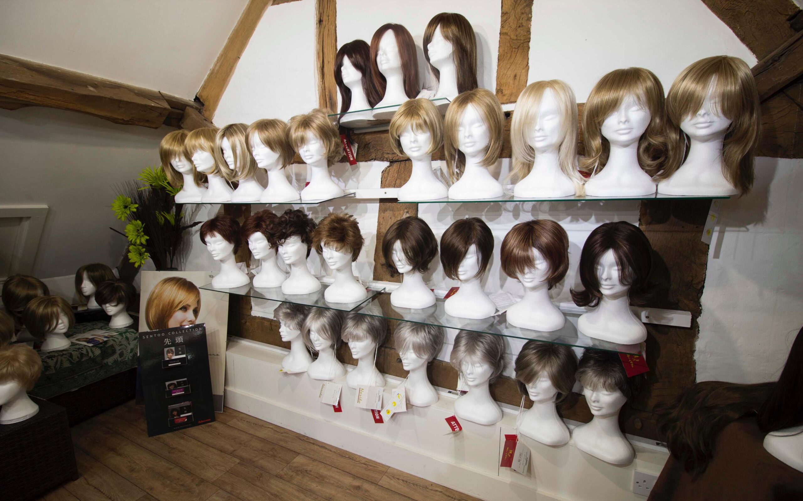 The wig room wall at Salon Ten